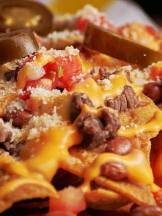 Cheesy Loaded Chicken Nachos Supreme